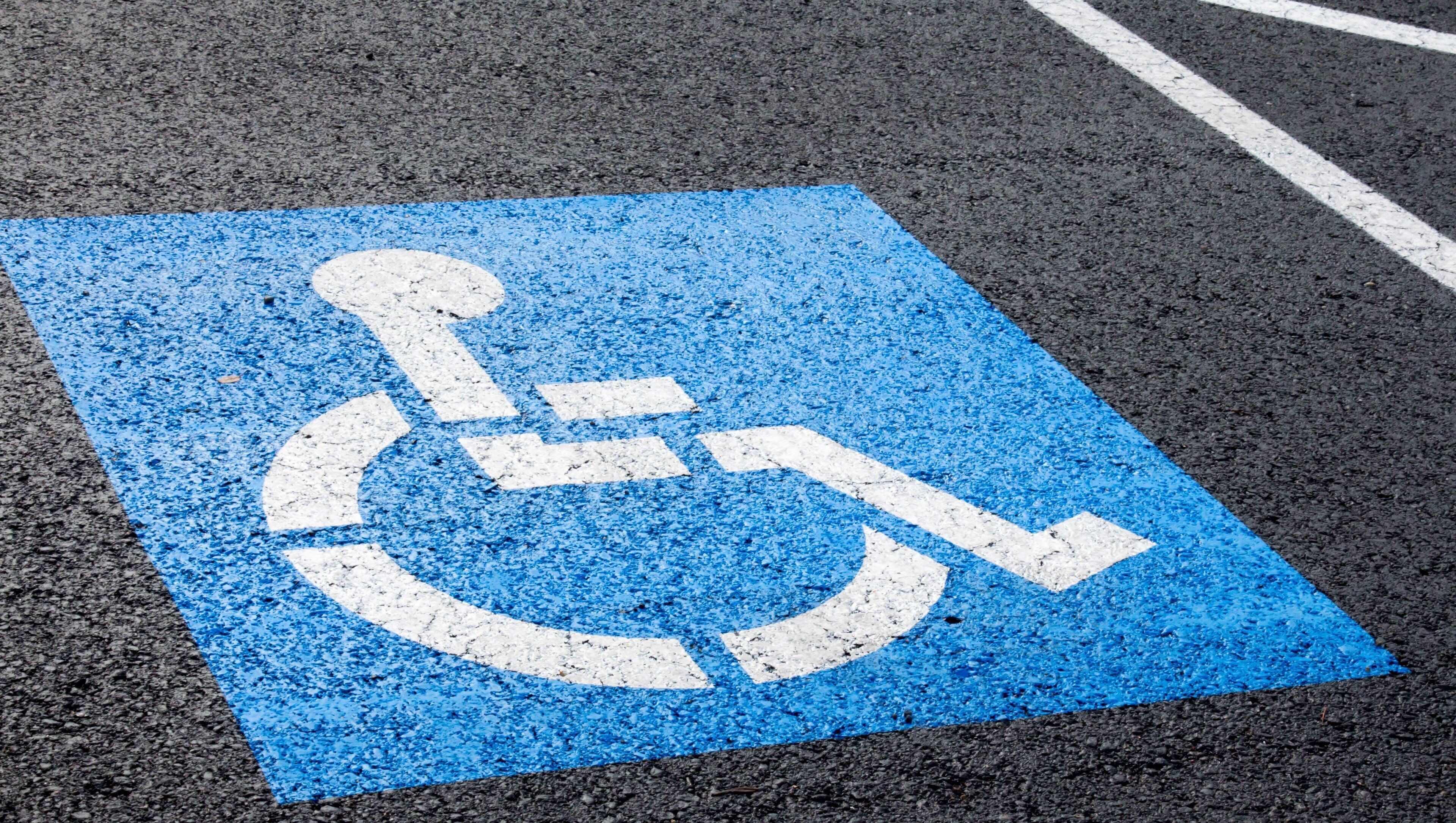 A parking space marked with a wheelchair accessibility symbol.