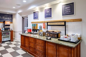 A breakfast station with a coffee machine, toaster, and various food containers. - Hampton Inn & Suites Mobile I-65@ Airport Blvd (Mobile)
