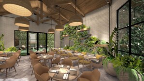 A modern indoor dining area with wooden ceiling beams, hanging wicker lamps, and a variety of seating arrangements. - The Greenleigh, River Oaks, Autograph Collection (Houston)