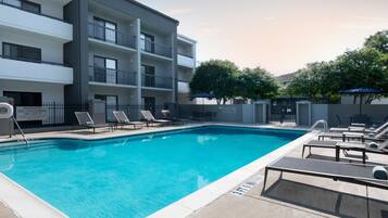 Outdoor pool, open 6:00 AM to 11:00 PM, pool umbrellas, pool loungers