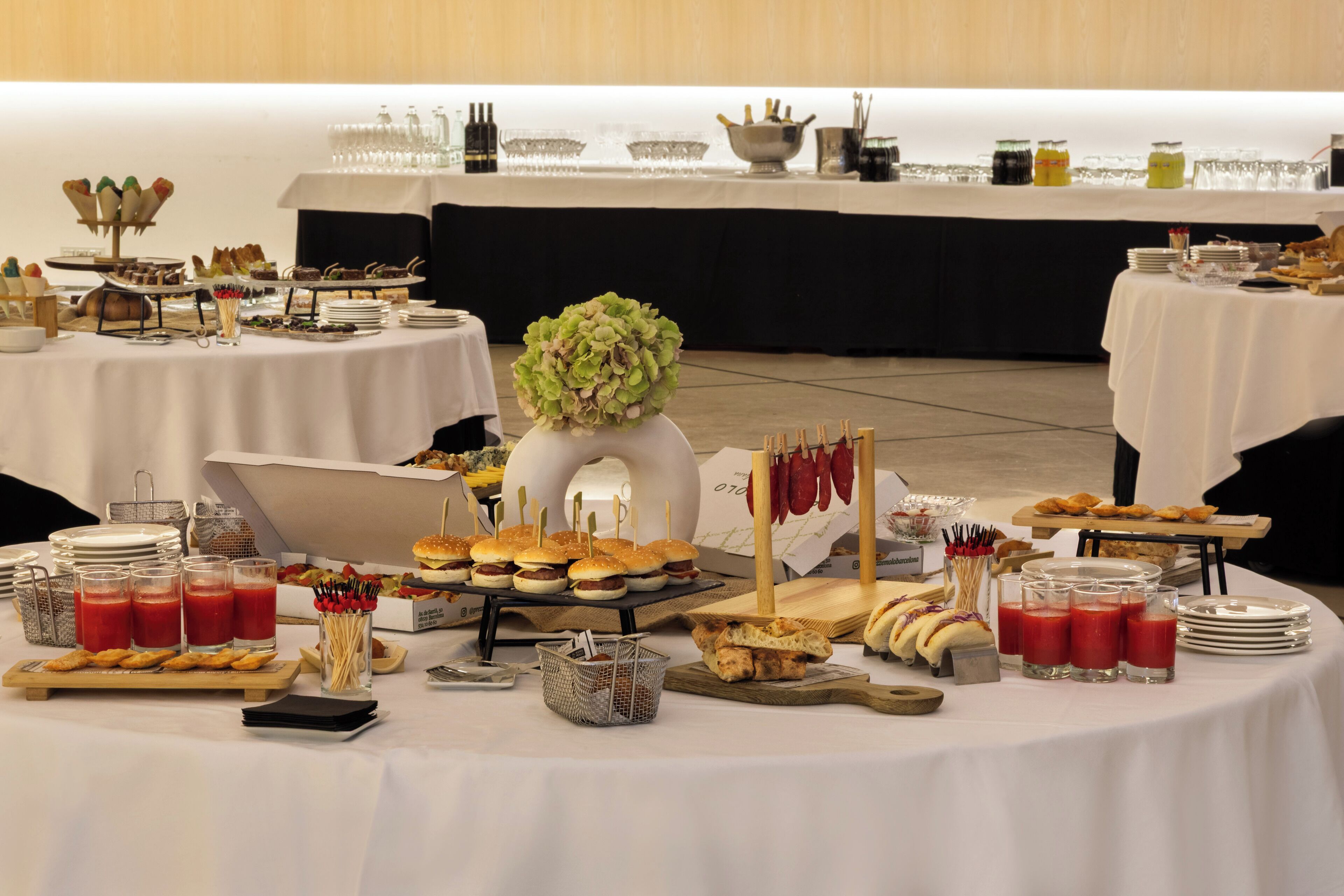 A buffet setup with various food items and beverages.
