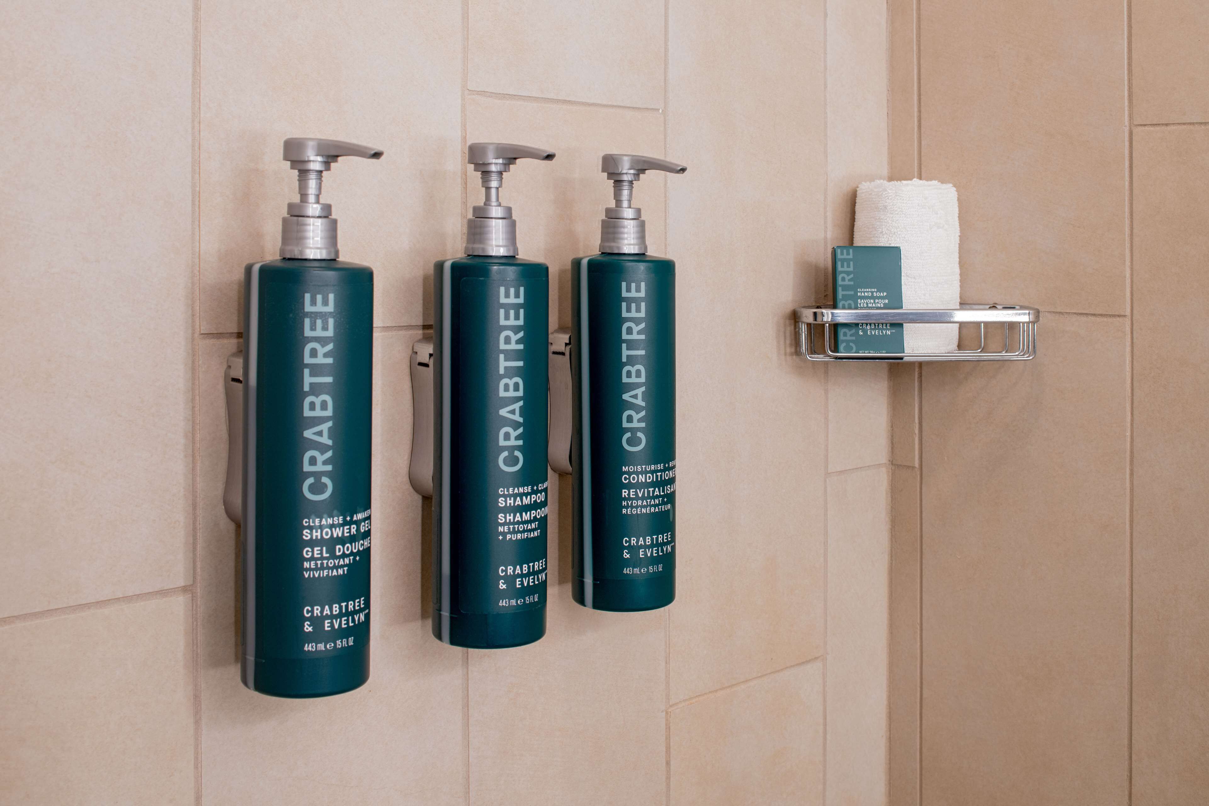 designer toiletries, hair dryer, towels, soap