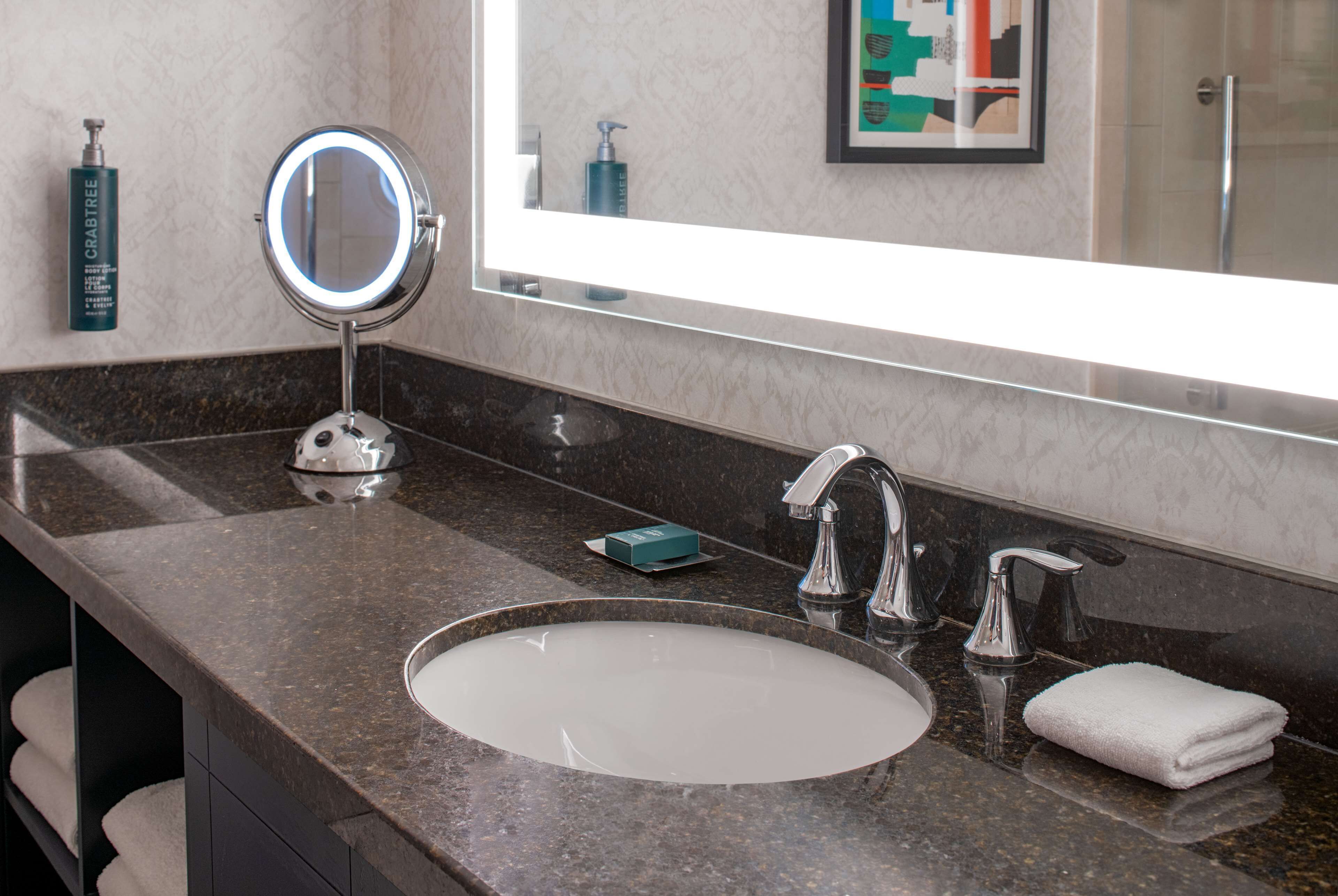 designer toiletries, hair dryer, towels, soap