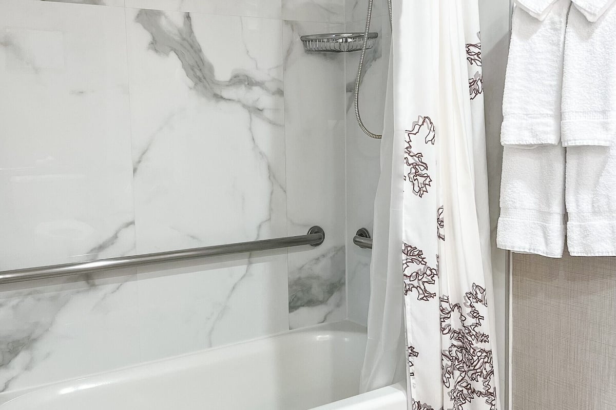 studio, 1 queen bed with sofa bed (mobility/hearing accessible, tub) | bathroom | free toiletries, hair dryer, towels, soap