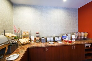 A buffet setup with various food items and appliances. - Residence Inn by Marriott La Mirada Buena Park (La Mirada)