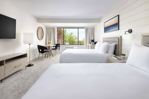 Desk, laptop workspace, iron/ironing board, free cribs/infant beds