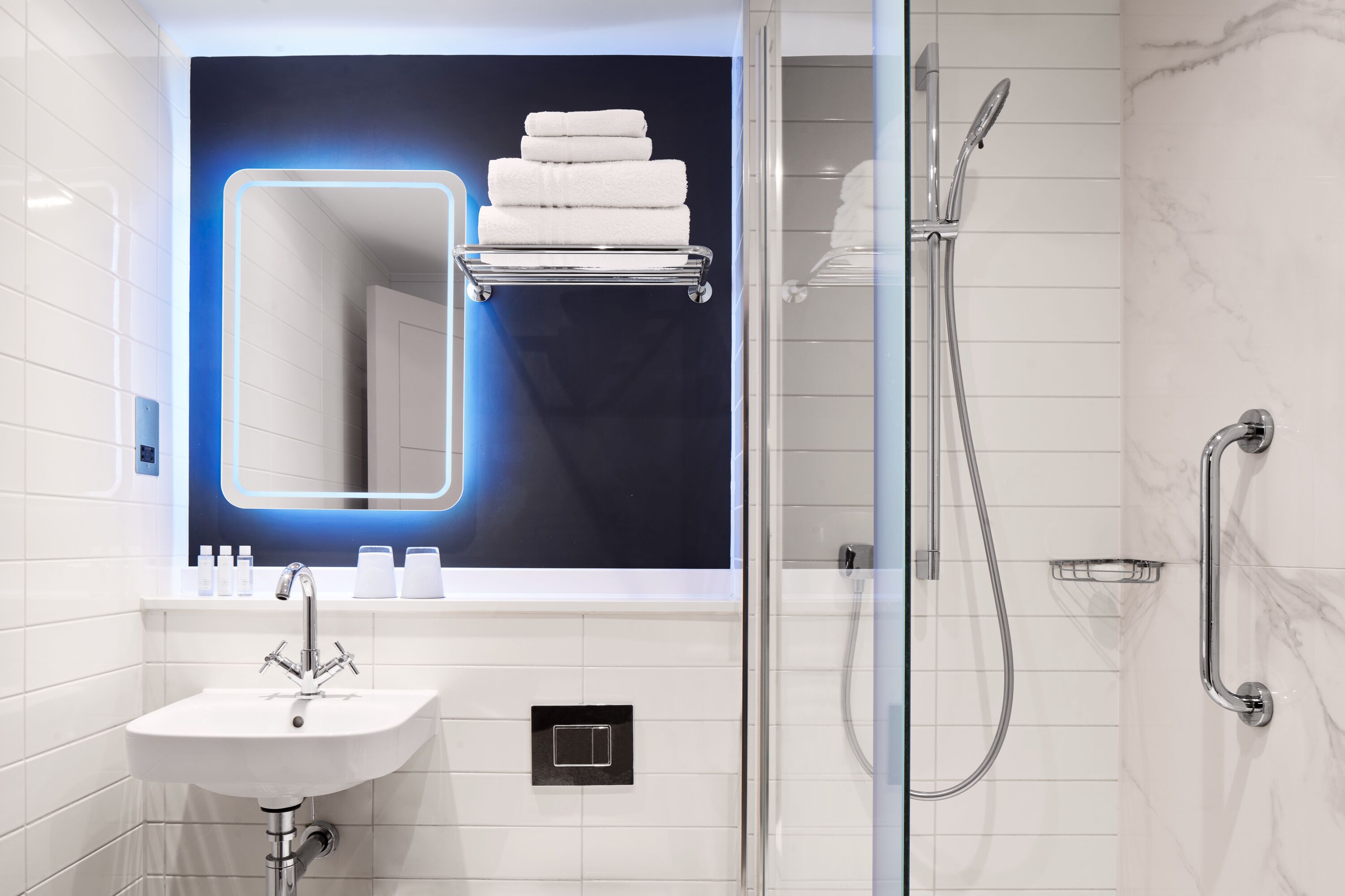 shower, designer toiletries, hair dryer, towels