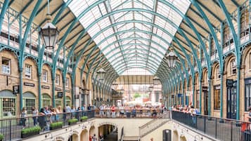 A covered market with a high, arched ceiling and multiple levels.