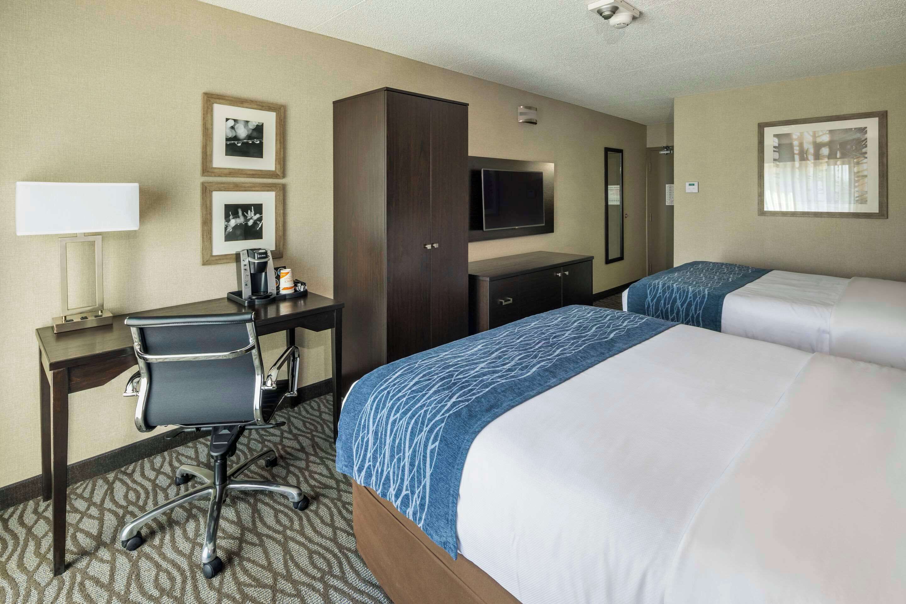 premium bedding, pillow-top beds, desk, blackout curtains