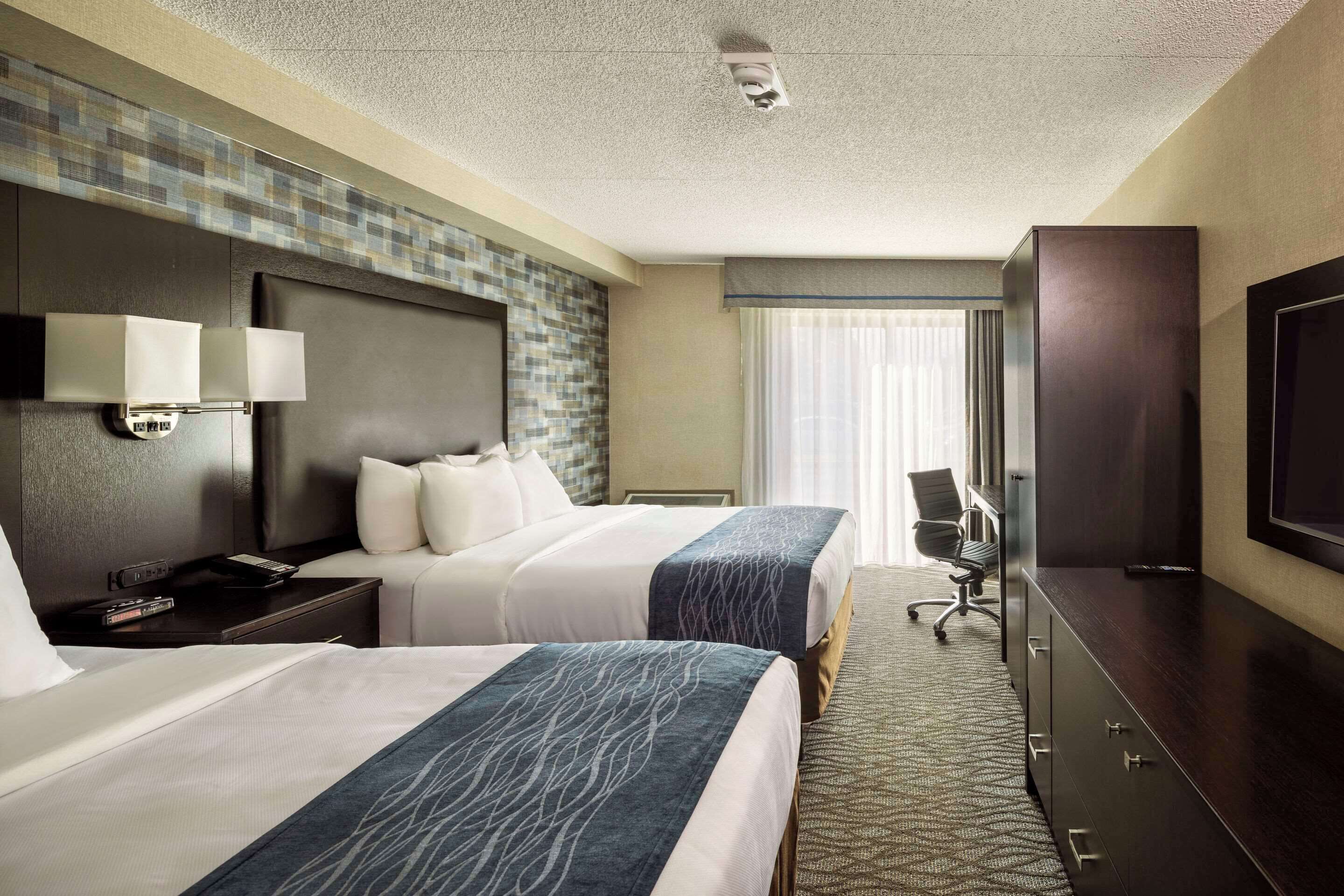 premium bedding, pillow-top beds, desk, blackout curtains