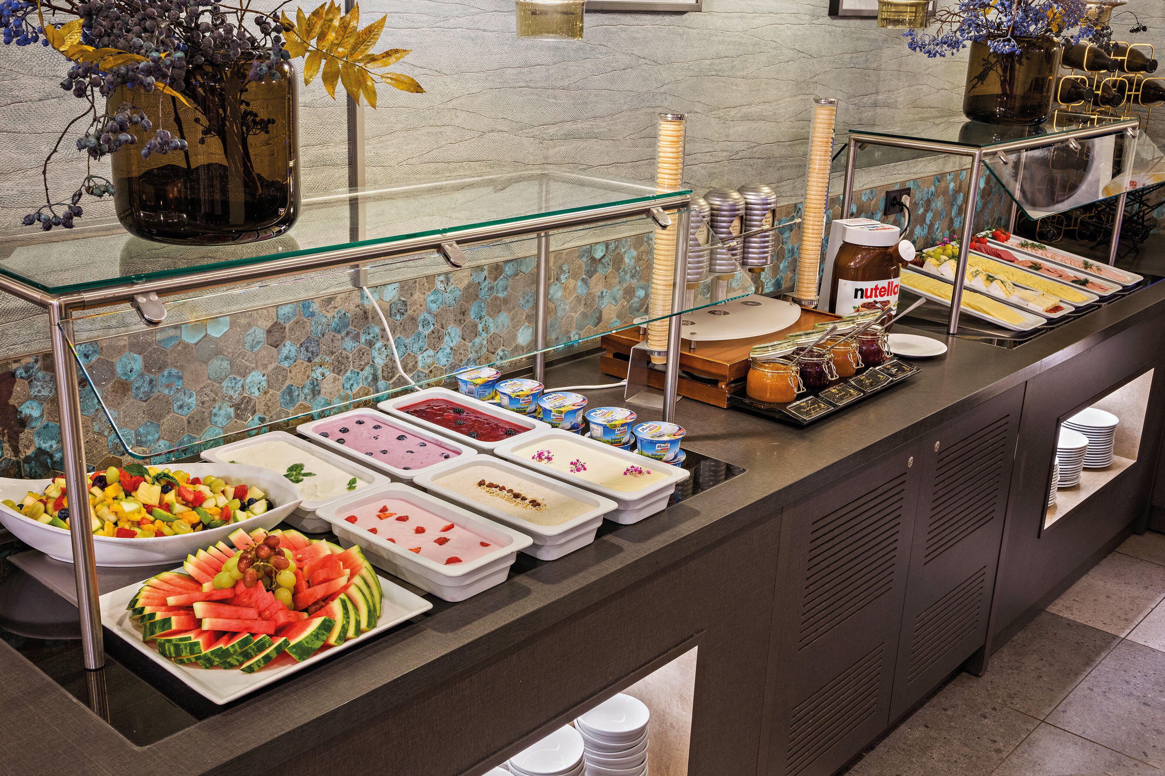 A buffet with various food items and condiments.