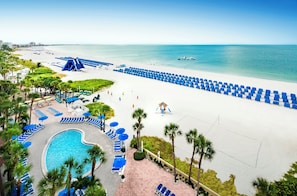 On the beach, white sand, free beach cabanas, beach towels