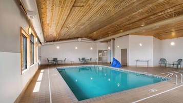 Indoor pool, open 8:00 AM to 11:00 PM, pool loungers