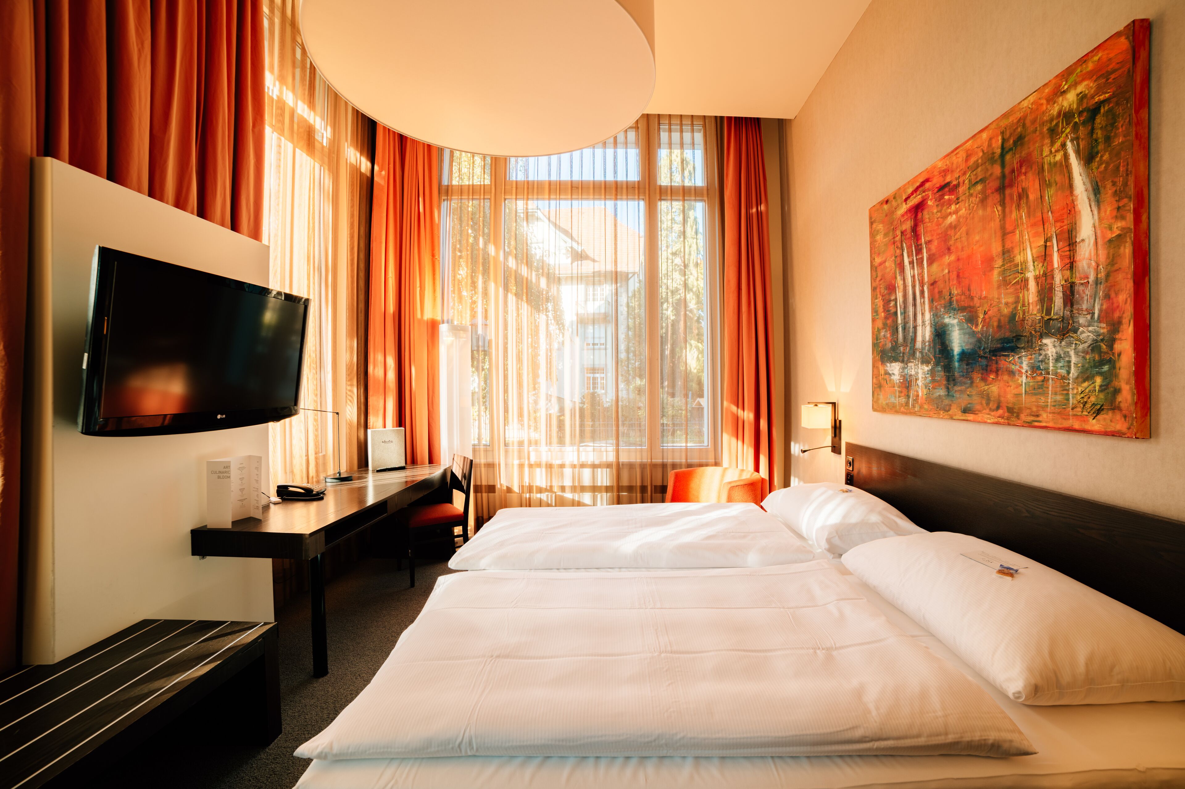 Hypo-allergenic bedding, free minibar, in-room safe, desk