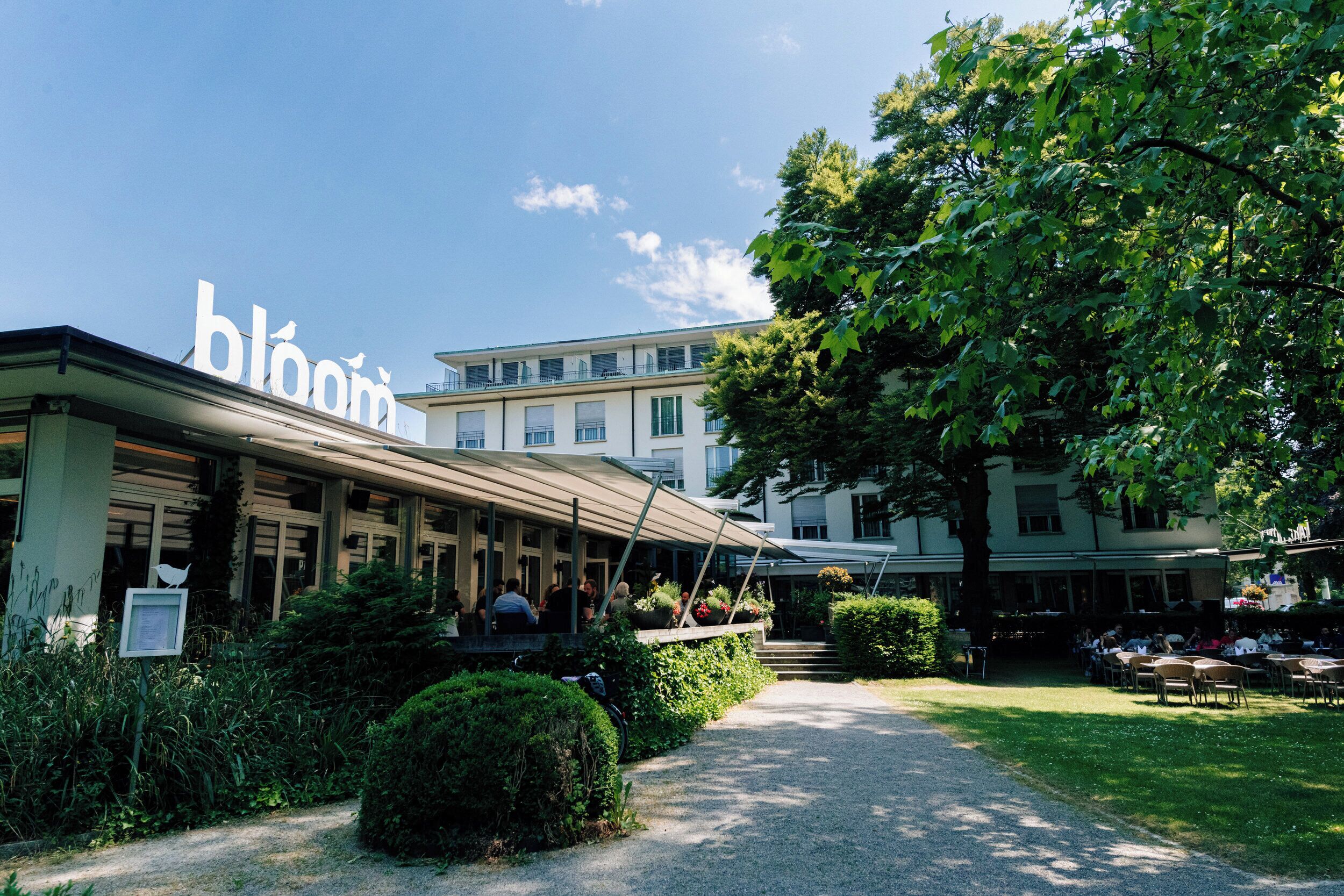 A building with a large sign reading "bloom".
