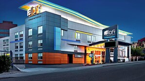 A modern hotel with a flat roof, large windows, and a prominent 'aloft' sign. - Aloft by Marriott Calgary University (Calgary)