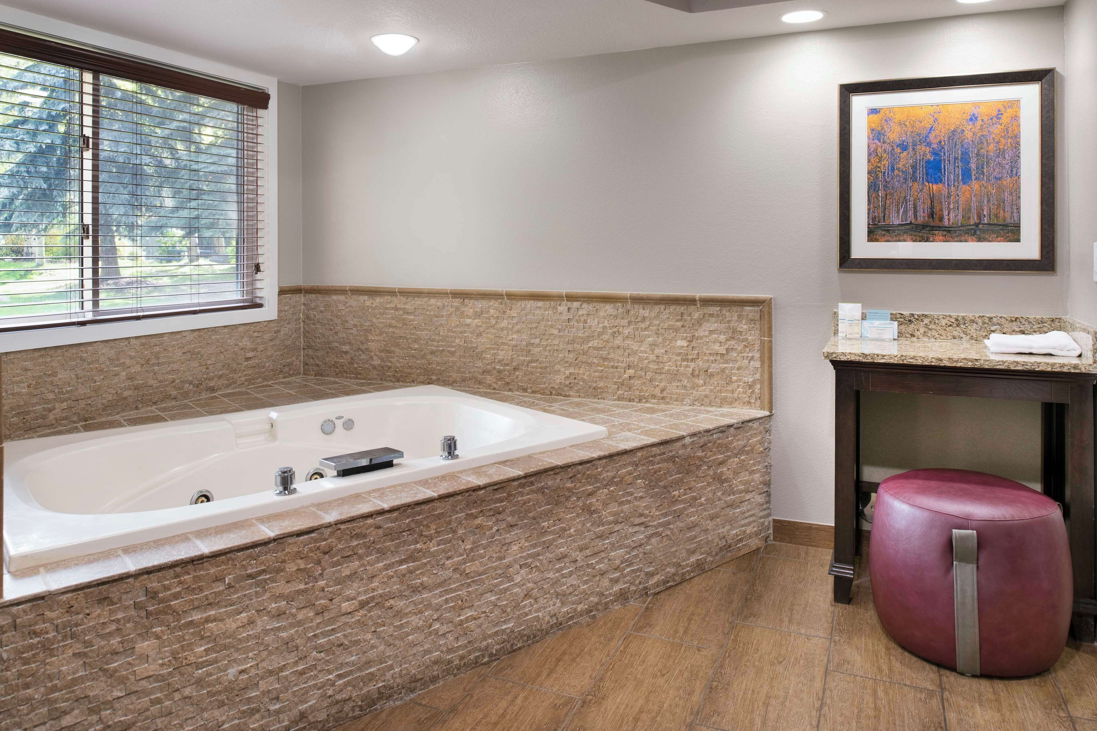 suite, 1 king bed, bathtub | bathroom | combined shower/bathtub, free toiletries, hair dryer, towels