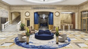 A grand lobby with a marble floor, a central seating area, and a staircase leading to upper floors. - Sofia Balkan Palace (Sofia)