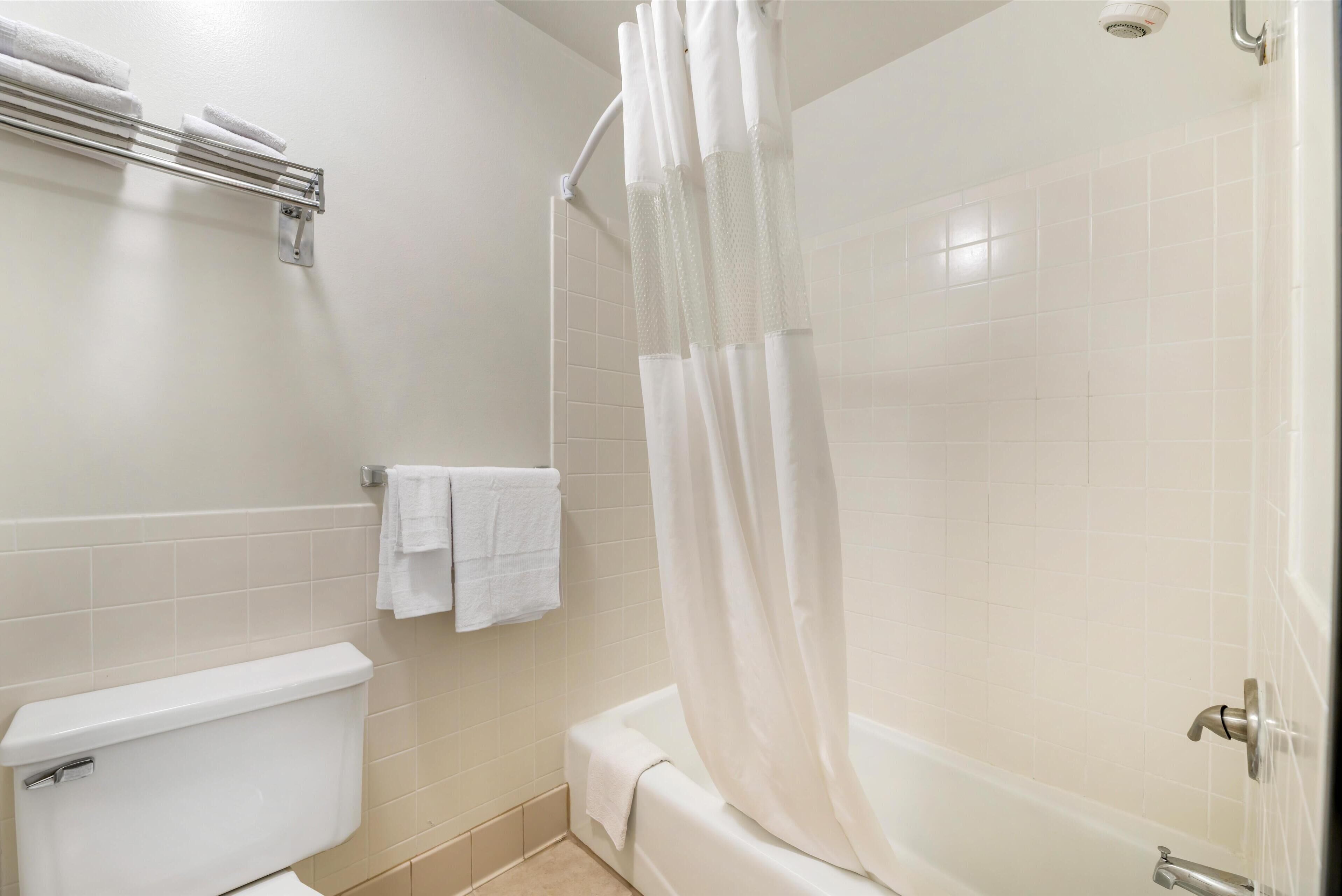 combined shower/bathtub, eco-friendly toiletries, hair dryer, towels
