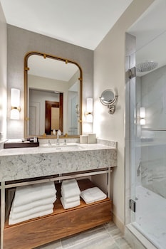 Shower, designer toiletries, hair dryer, bathrobes at Tideline Palm Beach Ocean Resort and Spa