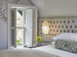 Junior Suite | 1 bedroom, pillowtop beds, in-room safe, individually decorated