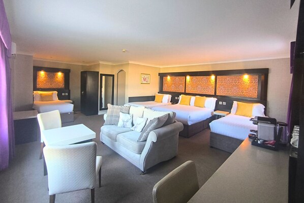 Deluxe Family Suite -Double Bed & 3 Single Beds | 1 bedroom, in-room safe, desk, iron/ironing board