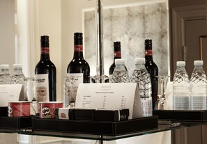 A wine and spirits display with a menu listing various brands and prices. - Phoenix Copenhagen (Copenhagen)