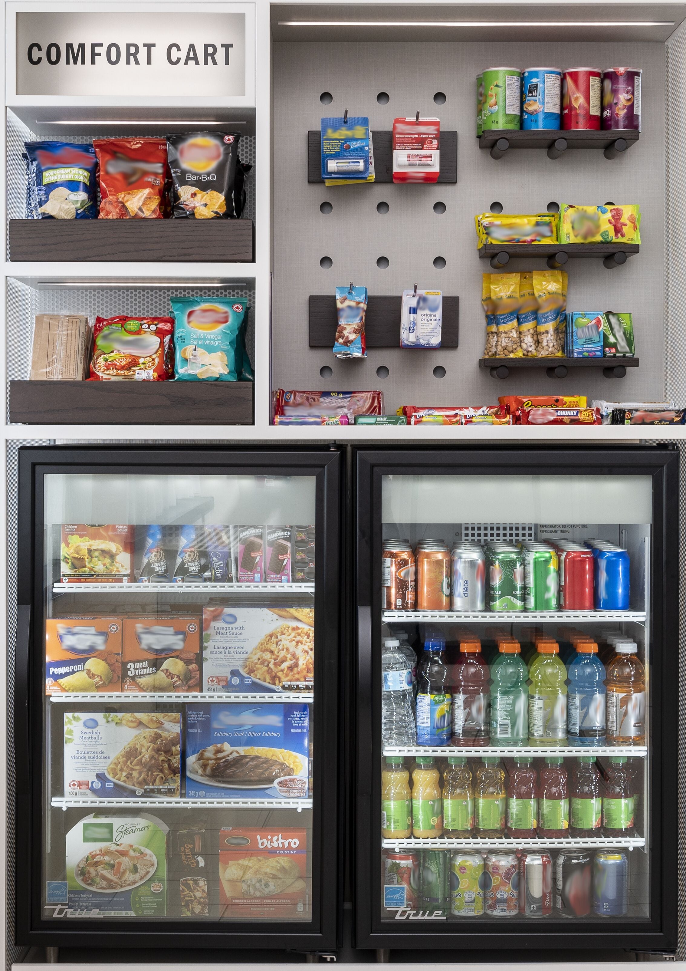 A comfort cart with snacks, beverages, and a refrigerator stocked with food and drinks.