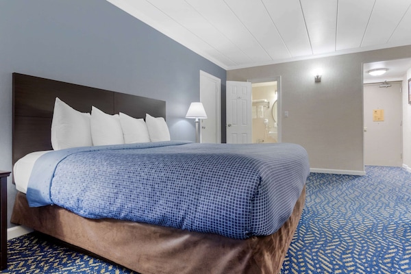 Desk, laptop workspace, blackout curtains, iron/ironing board