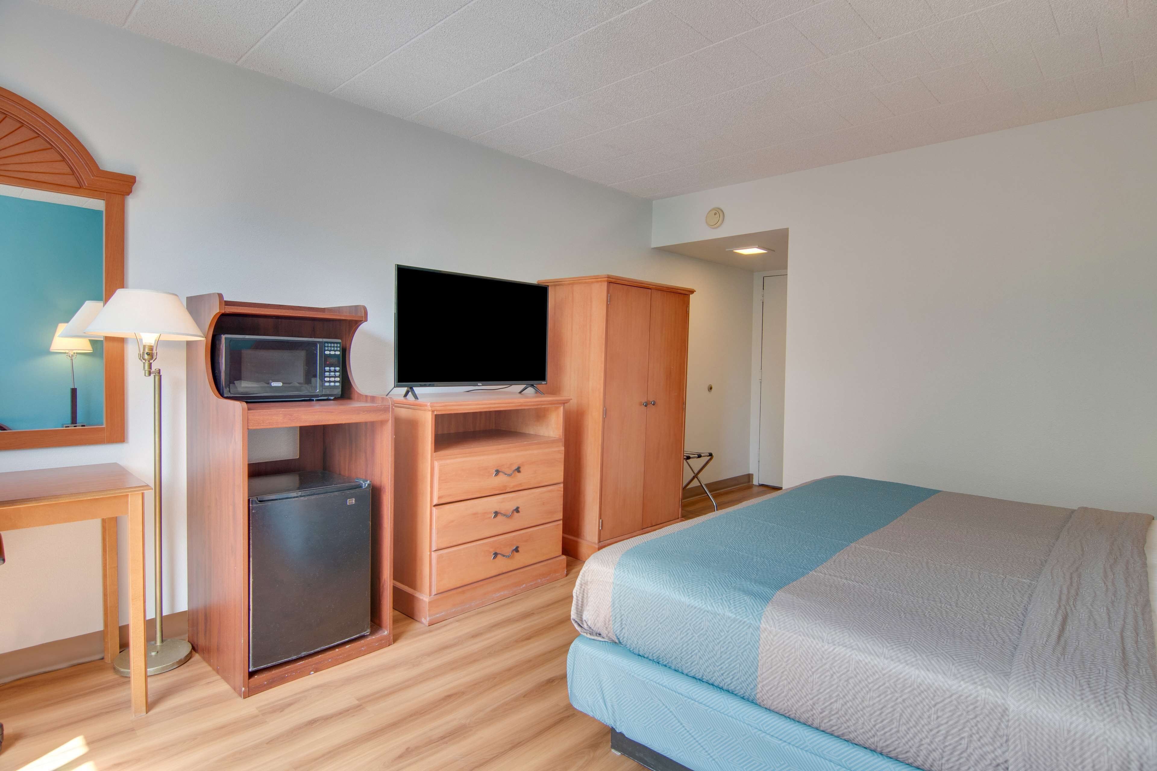 Desk, laptop workspace, blackout curtains, iron/ironing board