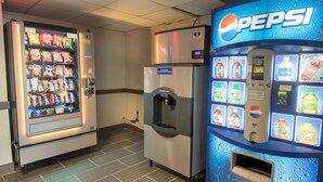 A vending machine area with a Pepsi machine and a snack vending machine.