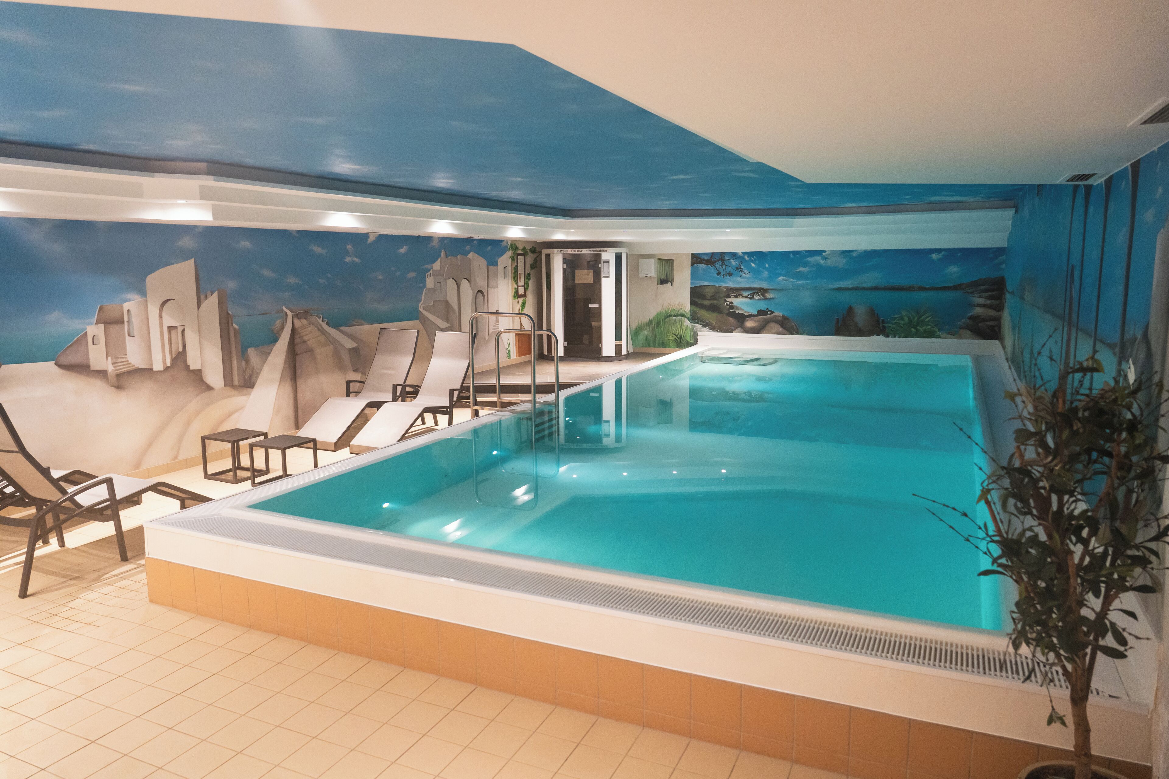 Indoor pool, open 6:30 AM to 10:30 PM, pool loungers