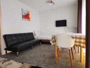 Standard Suite, 1 Bedroom, Non Smoking, Kitchen | Living area | 32-inch flat-screen TV with cable channels, TV