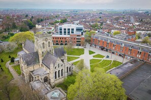 An aerial view of a university campus with historic buildings, a central courtyard, and surrounding residential areas. - Corus St James Hotel Grimsby (Grimsby)