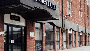 A hotel with a sign reading 'ST. JAMES HOTEL' and a smaller sign below it that says 'CORUS THE ST. JAMES CRIMEY.' - Corus St James Hotel Grimsby (Grimsby)