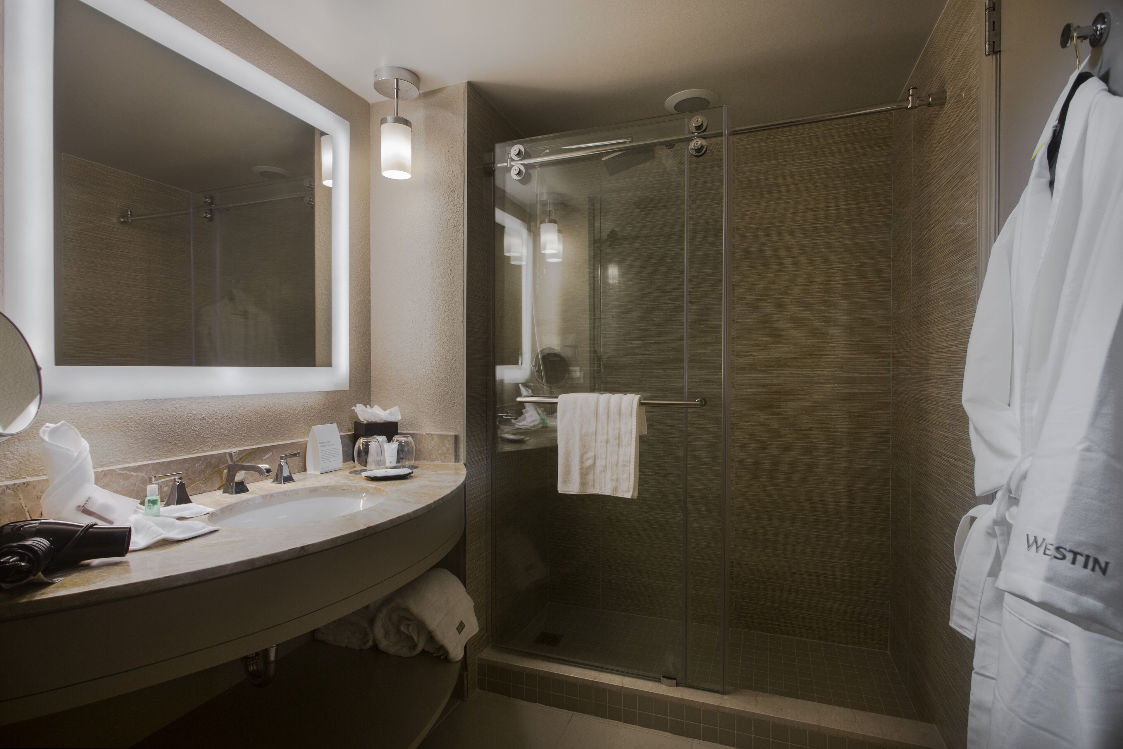 rainfall showerhead, designer toiletries, hair dryer, bathrobes