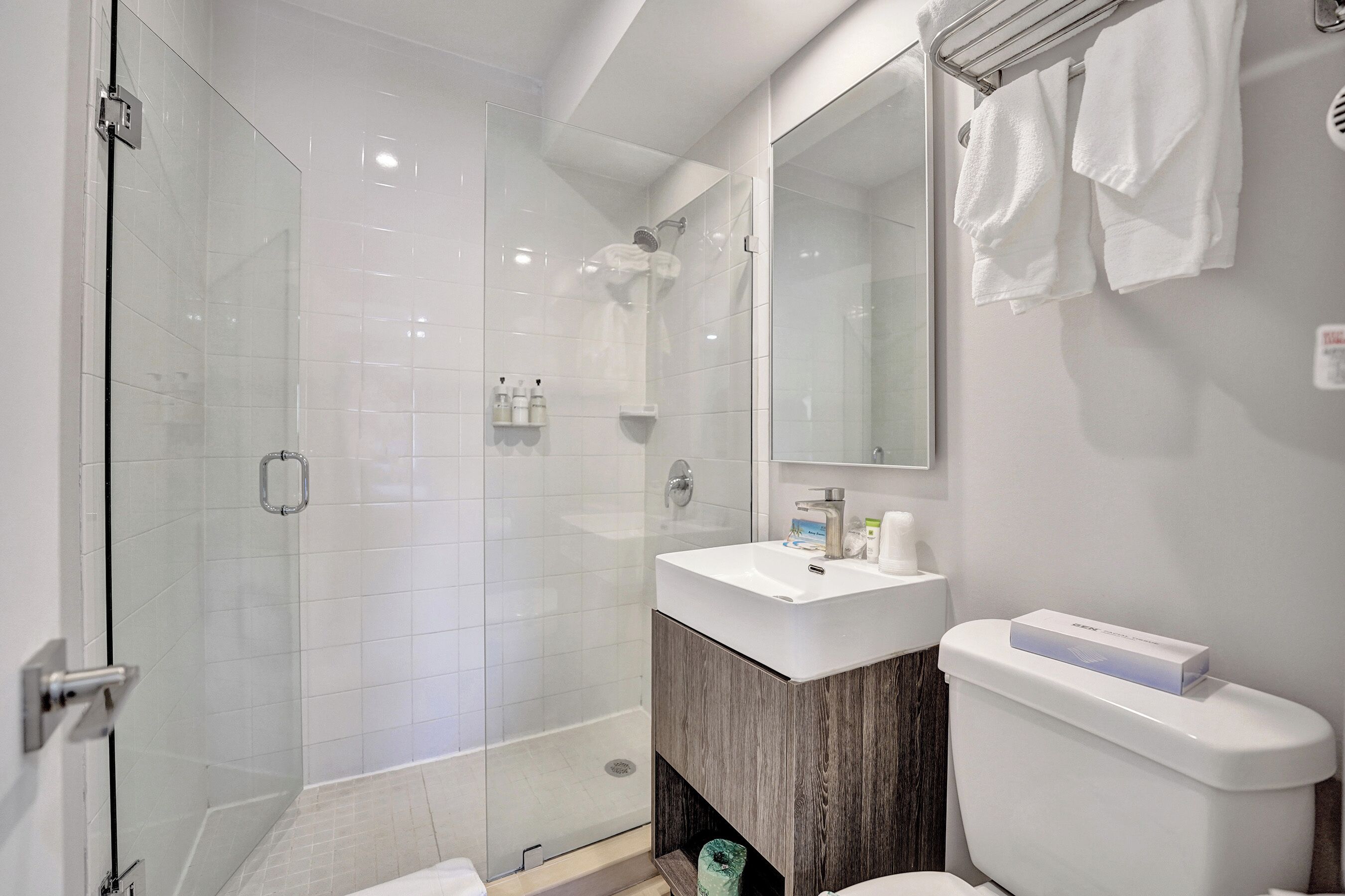 standard room, 1 king bed, partial sea view | bathroom | shower, eco-friendly toiletries, hair dryer, towels