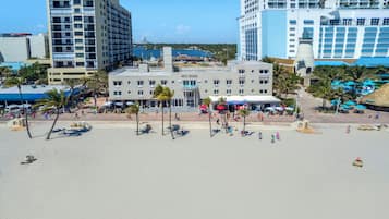 Situated on the beachfront, this hotel offers stunning views and a resort-like atmosphere with outdoor seating areas and palm trees.