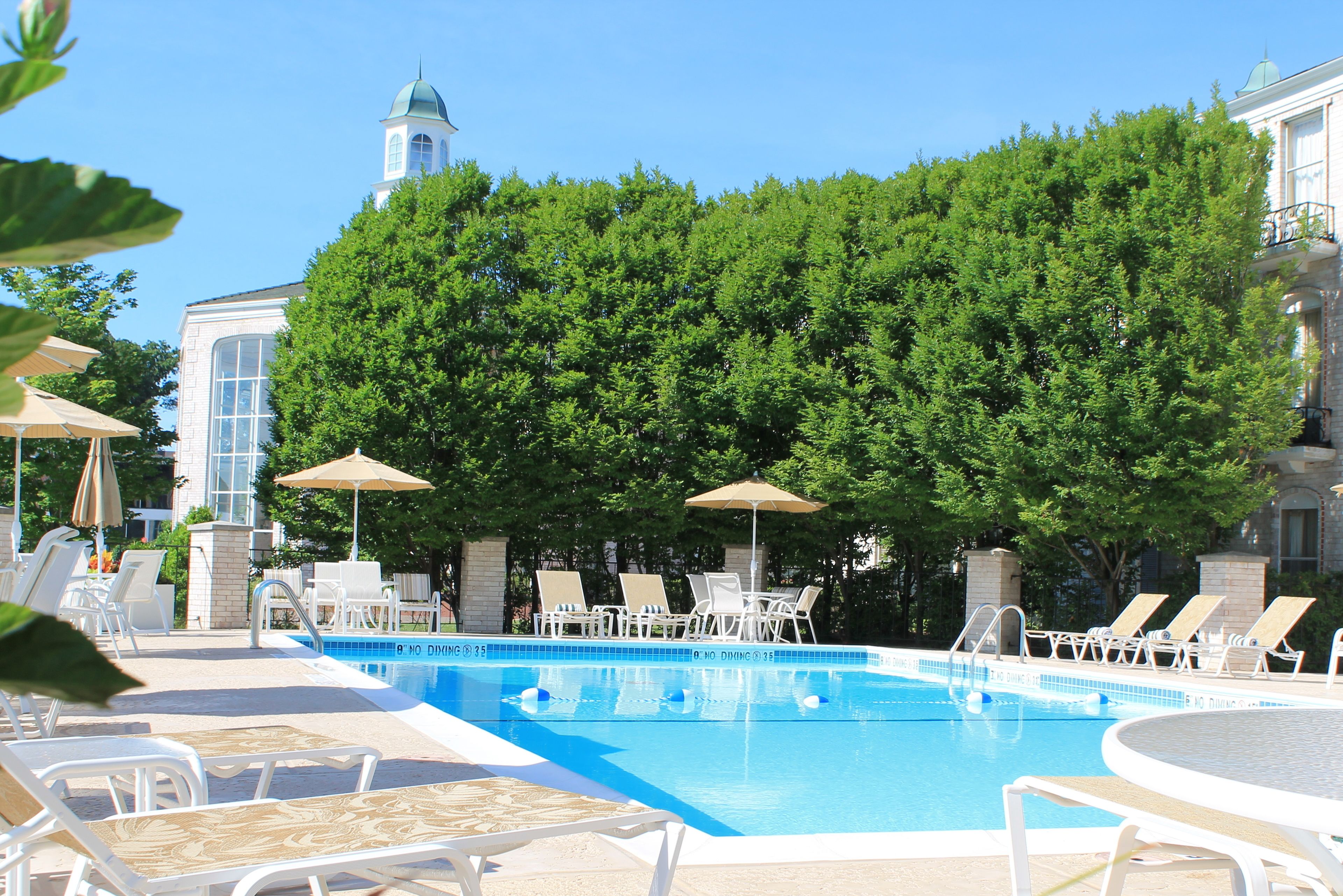 seasonal outdoor pool, open 9:00 am to 10:00 pm, pool umbrellas
