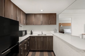 Hypo-allergenic bedding, desk, laptop workspace, blackout drapes
