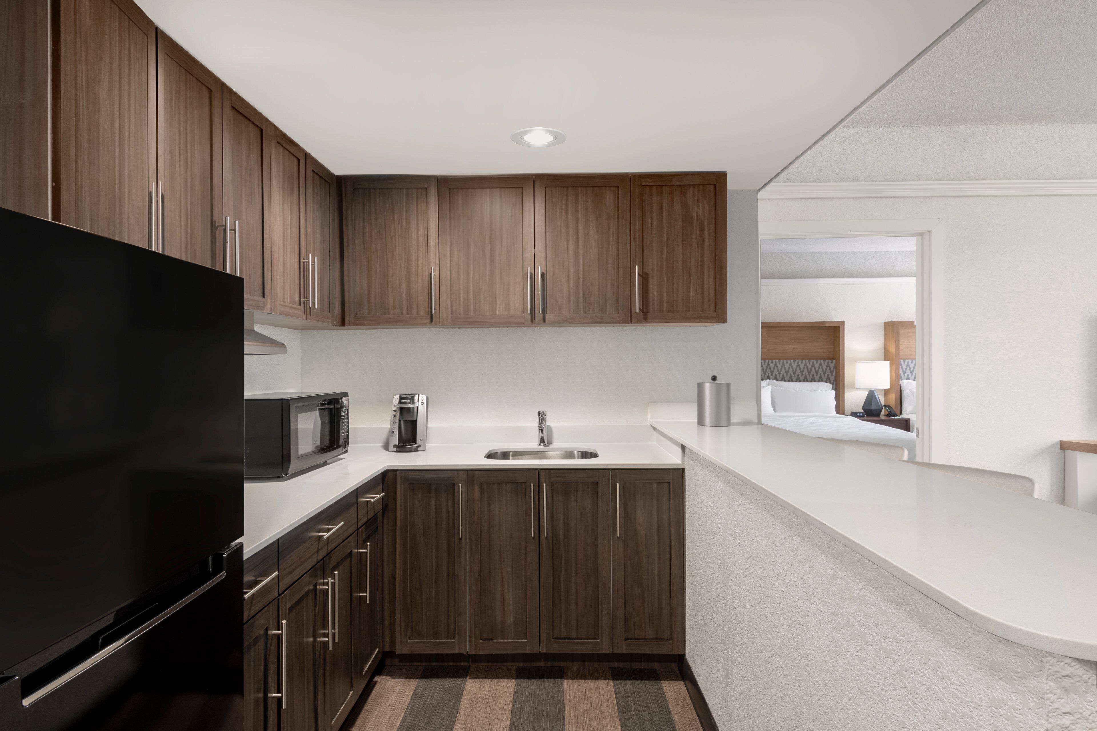 Hypo-allergenic bedding, desk, laptop workspace, blackout curtains