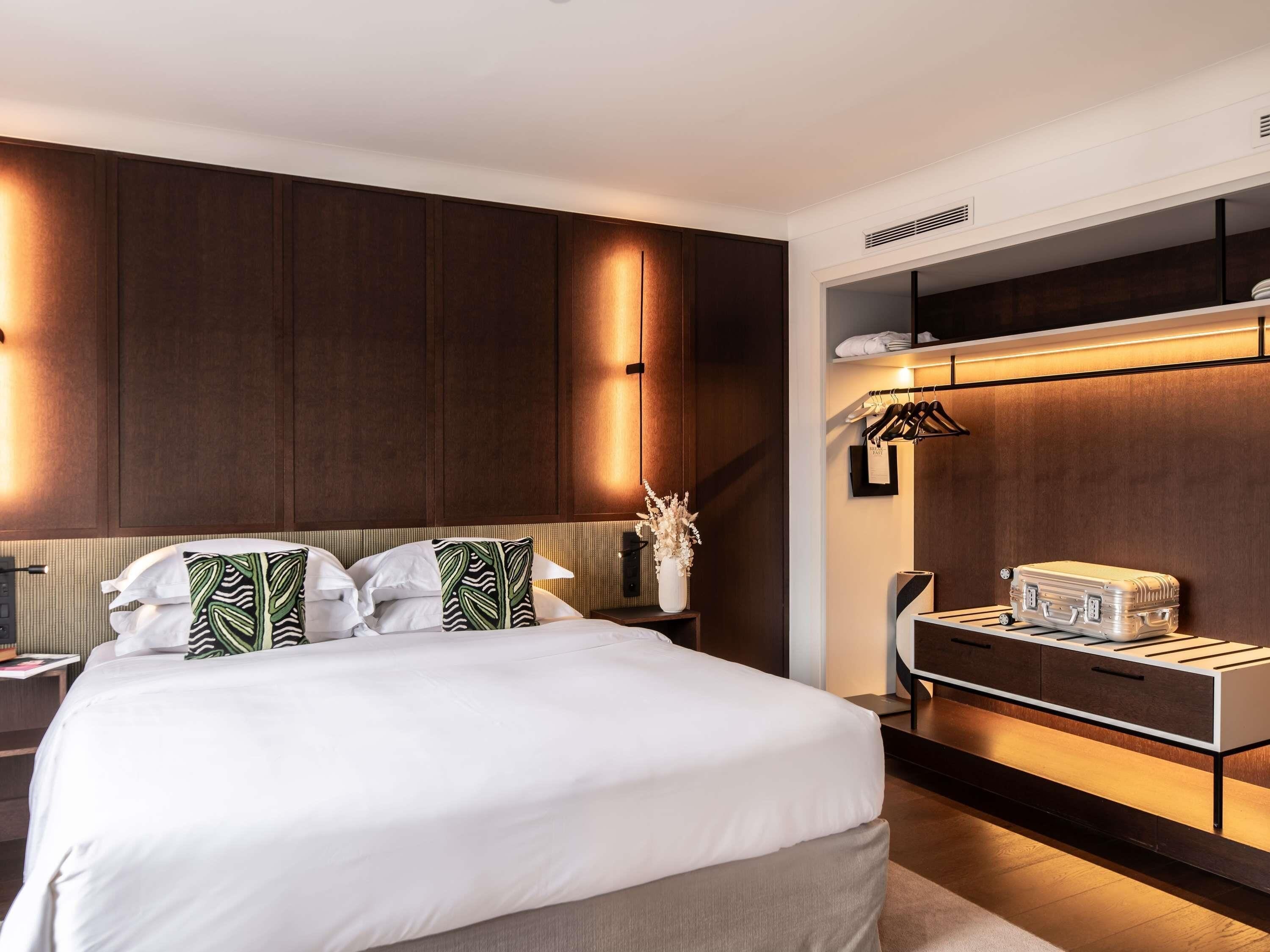 Premium bedding, down comforters, pillowtop beds, free minibar