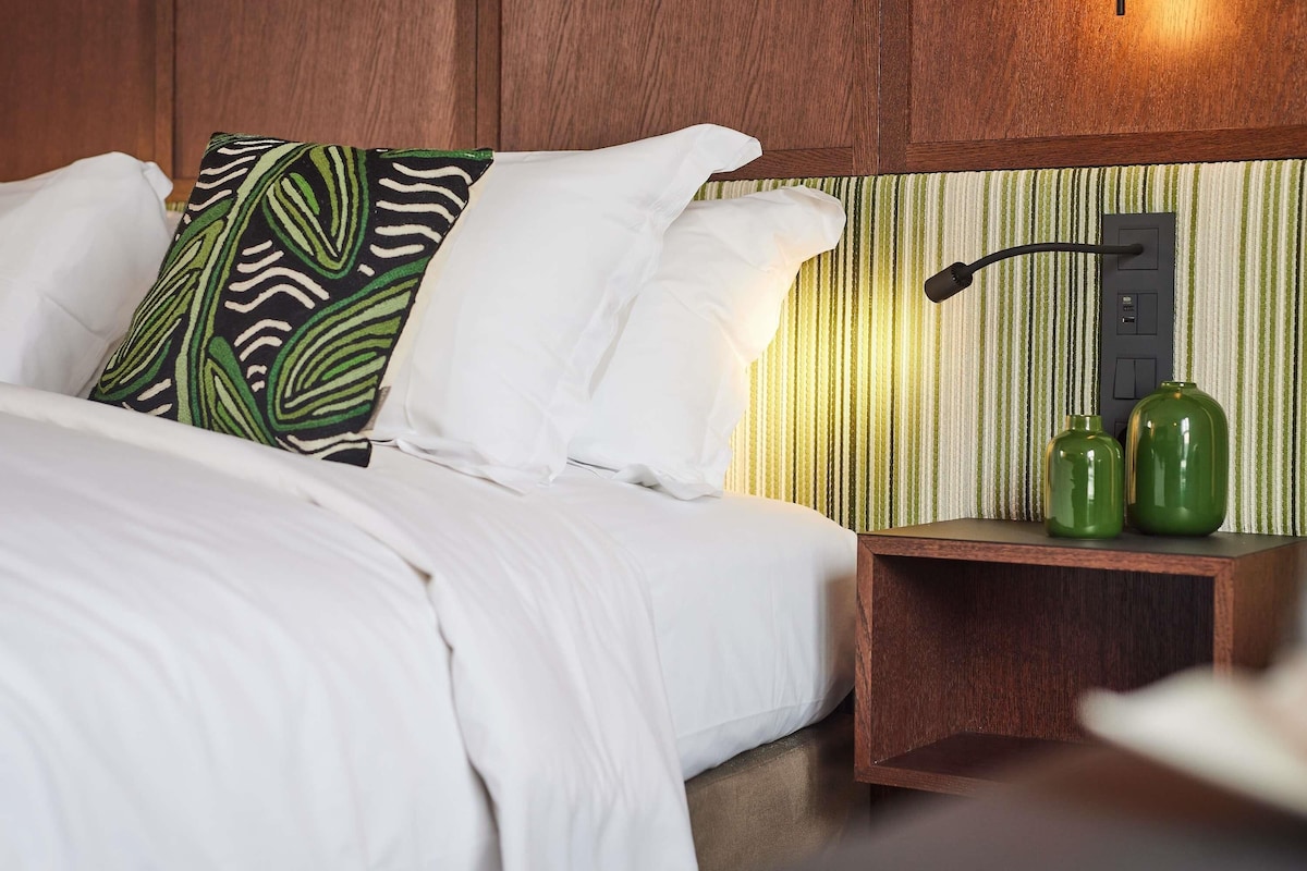 Premium bedding, down duvets, pillow-top beds, free minibar