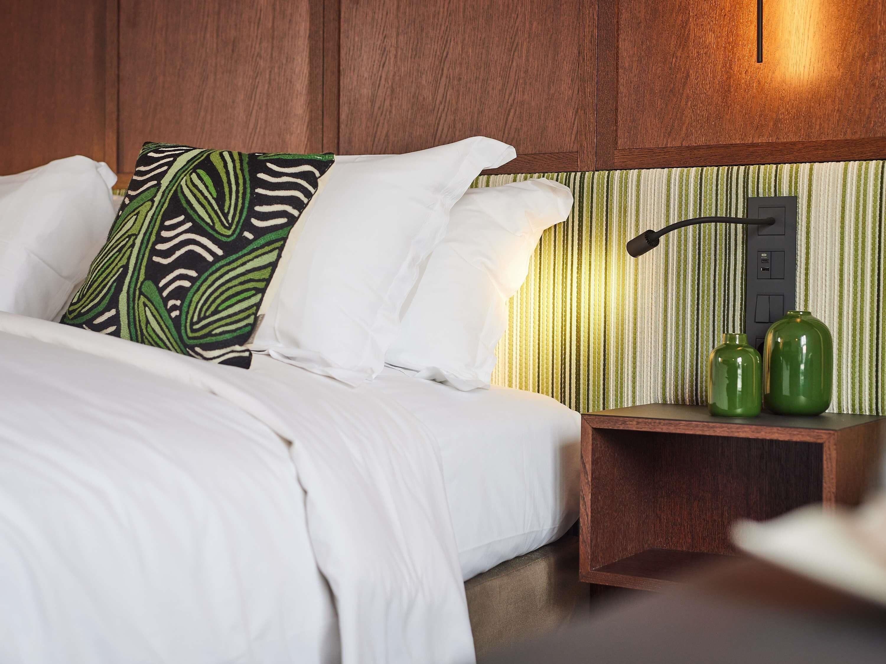 Premium bedding, down comforters, pillowtop beds, free minibar