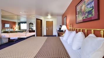 Deluxe Suite, 1 Queen Bed, Jetted Tub | Desk, blackout curtains, iron/ironing board, free WiFi