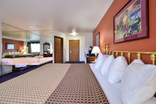 Deluxe Suite, 1 Queen Bed, Jetted Tub | Desk, blackout curtains, iron/ironing board, free WiFi