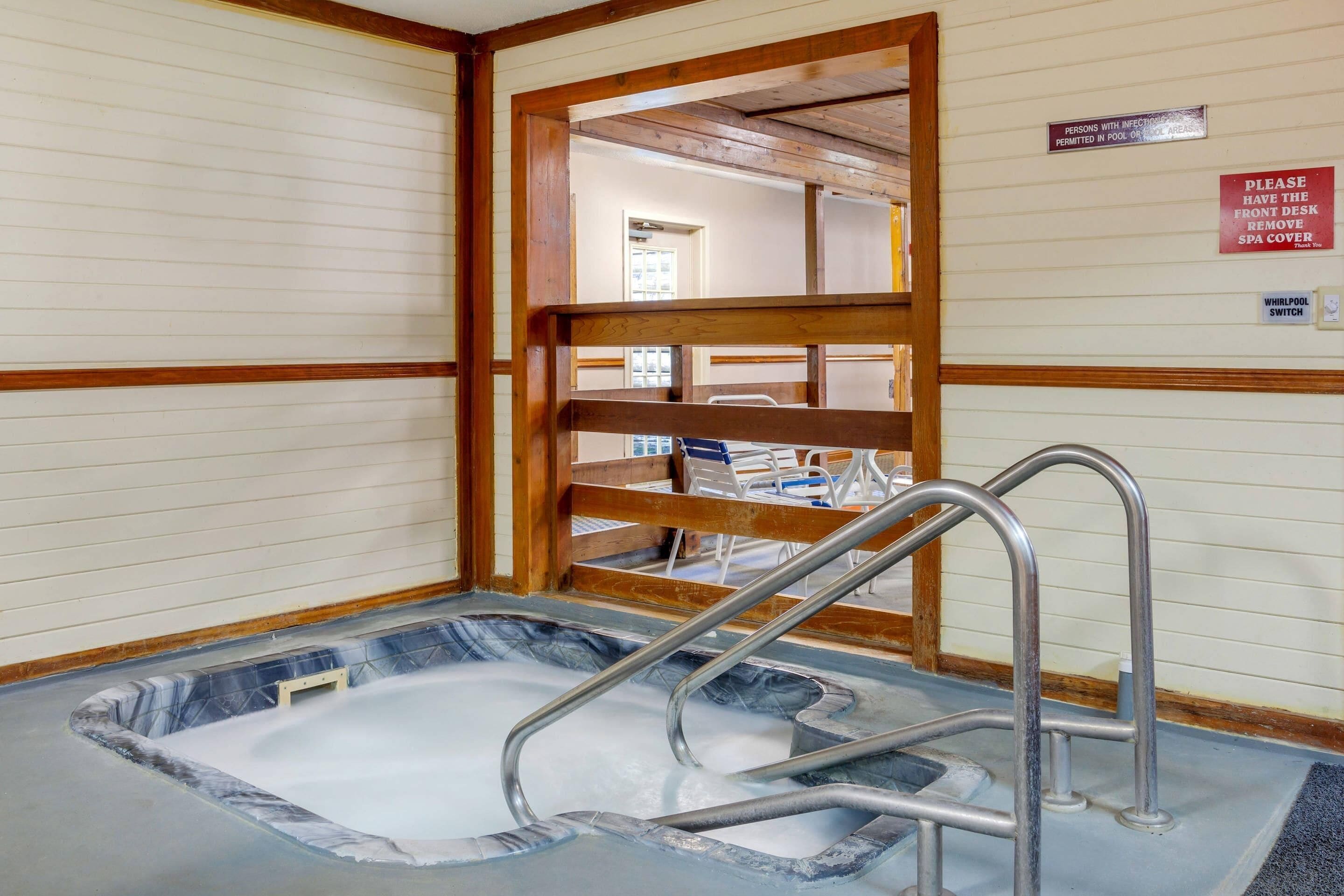 Indoor pool, open 7 AM to 10 PM, pool loungers