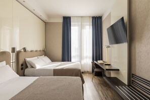Quadruple Room | Minibar, in-room safe, soundproofing, iron/ironing board