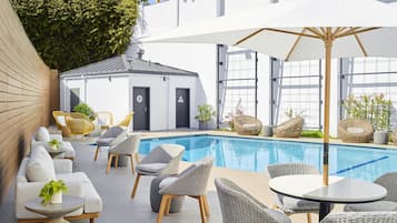 Outdoor pool, open 7:00 AM to 8:00 PM, pool loungers