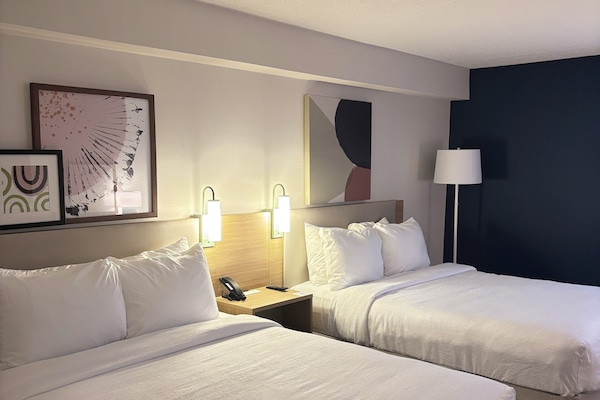 Room, 2 Queen Beds | Desk, blackout drapes, iron/ironing board, free cribs/infant beds